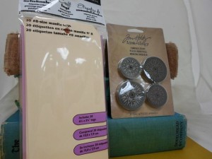 20 manilla tags and Tim's Holtz idea-ology compass coins
